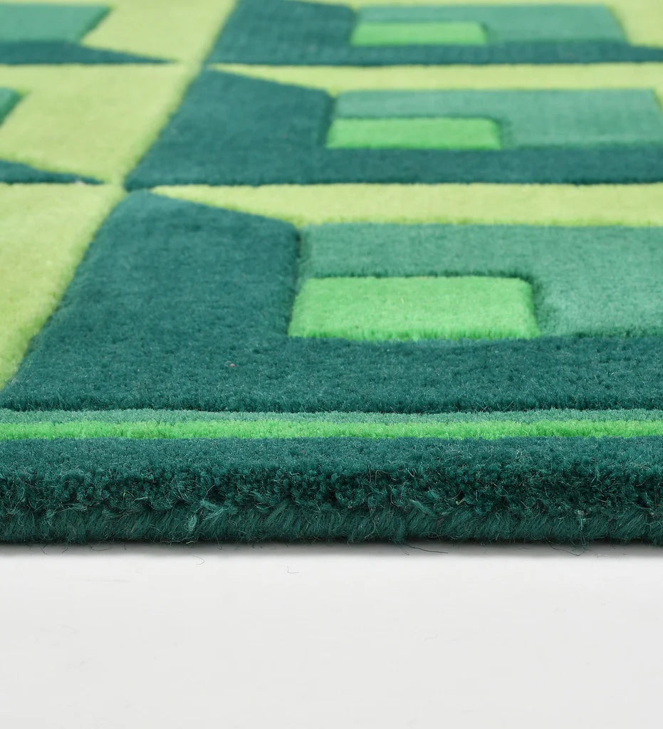 Bold geometric green wool rug for modern and eclectic interiors