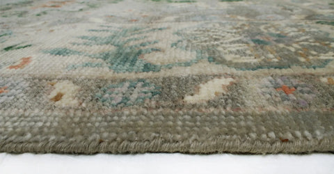 Green Oriental-style rug with central medallion and floral motifs