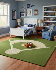 Green and beige baseball field sports-inspired hand-tufted area rug placed in a kids’ room, adding a playful, sporty, and fun-themed decor accent