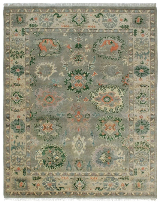Hand-knotted green Oriental rug with floral medallion design