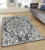 Grey and white hand-tufted traditional wool rug on tiled floor in modern living room with grey sofa