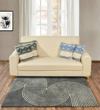 Grey abstract hand-tufted wool rug with white curved lines under beige sofa with patterned cushions in modern living room