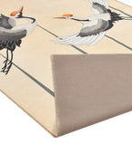 Ivory luxury rug with handwoven crane bird design and geometric lines, detail of corner fold