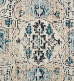 Ivory distressed Persian rug with intricate vintage floral and geometric patterns in blue and black