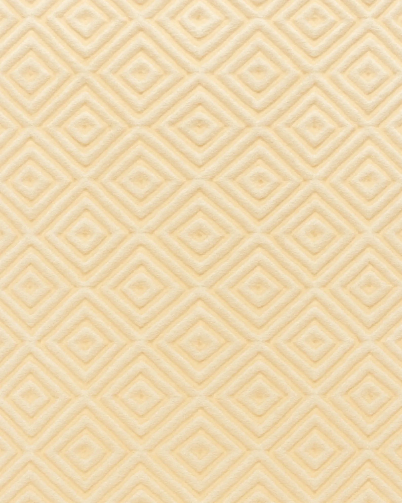 Soft ivory wool rug with sculpted diamond texture handmade in India.