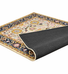 Hand-tufted wool rug with floral medallion and ornate patterns