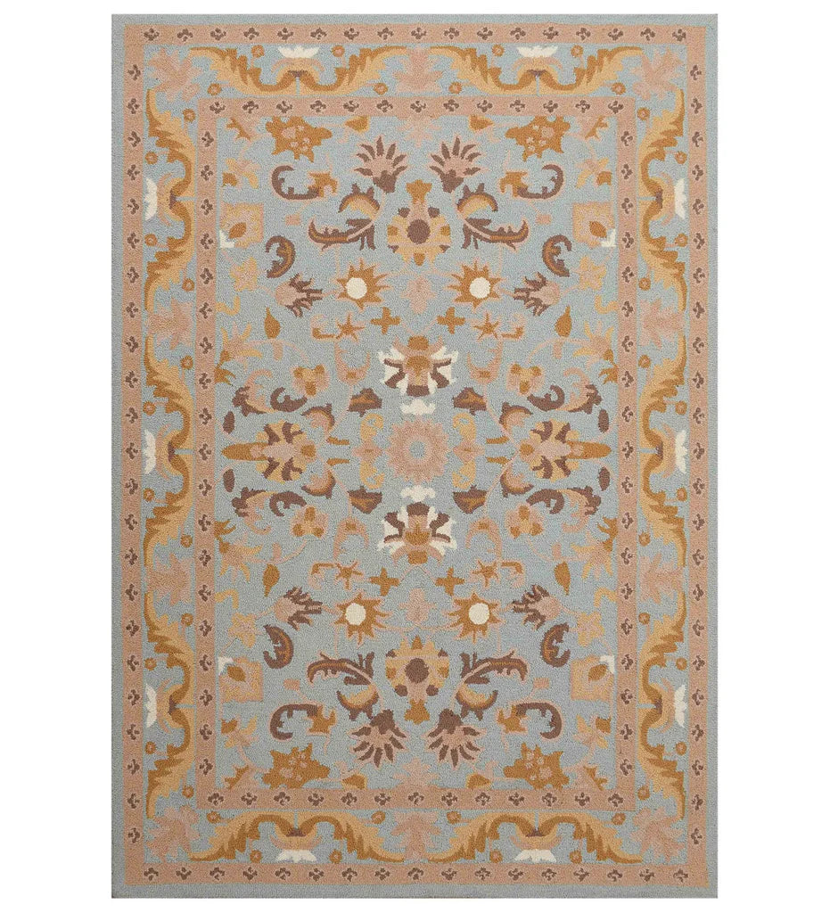 Light blue and beige traditional rug with floral medallion design.