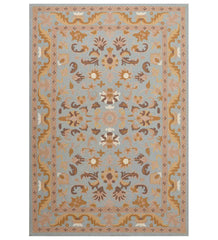 Light blue and beige traditional rug with floral medallion design.