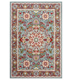 Light blue hand-tufted rug with intricate floral and geometric patterns, multicolor accents