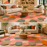 Living room with a colorful geometric rug, sofa, and coffee table.

