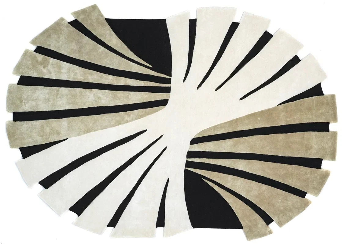 Modern abstract oval wool rug in beige and black tones.