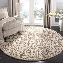 Luxury round wool rug in beige tones for living rooms.