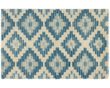 Luxury blue geometric diamond rug for modern interiors.