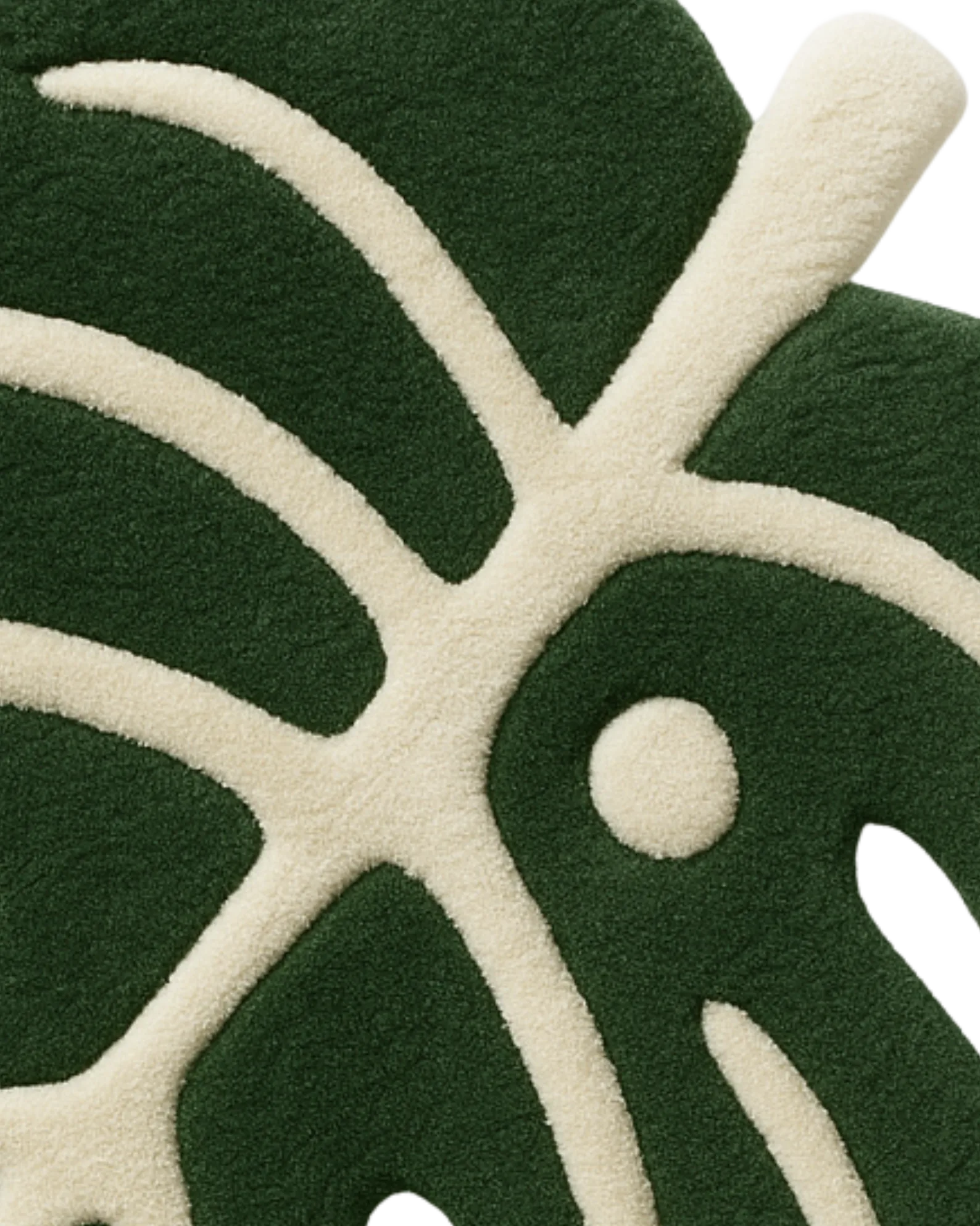 Handcrafted green leaf-shaped rug with cream detailing.