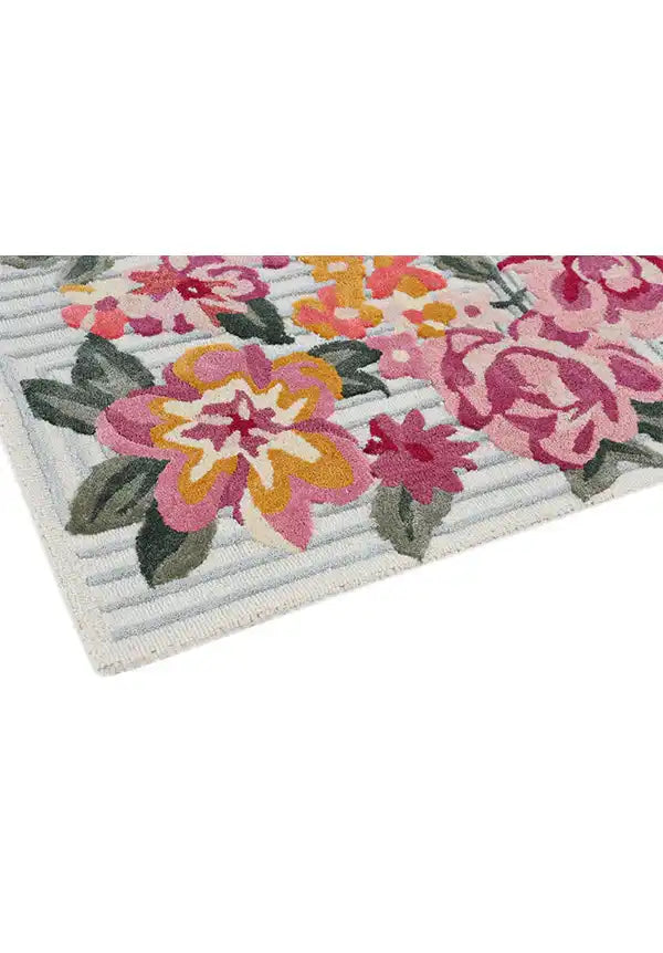 Handcrafted floral area rug with rich botanical detailing.