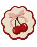 Round cherry bow hand-tufted wool rug with red border and pink ribbon design.