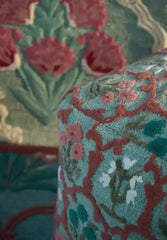 Luxury botanical area rug with teal and pink floral motifs.