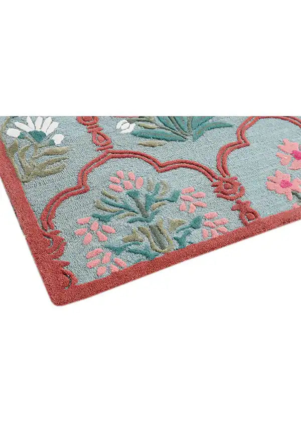 Premium wool rug with repeating vintage floral panels.