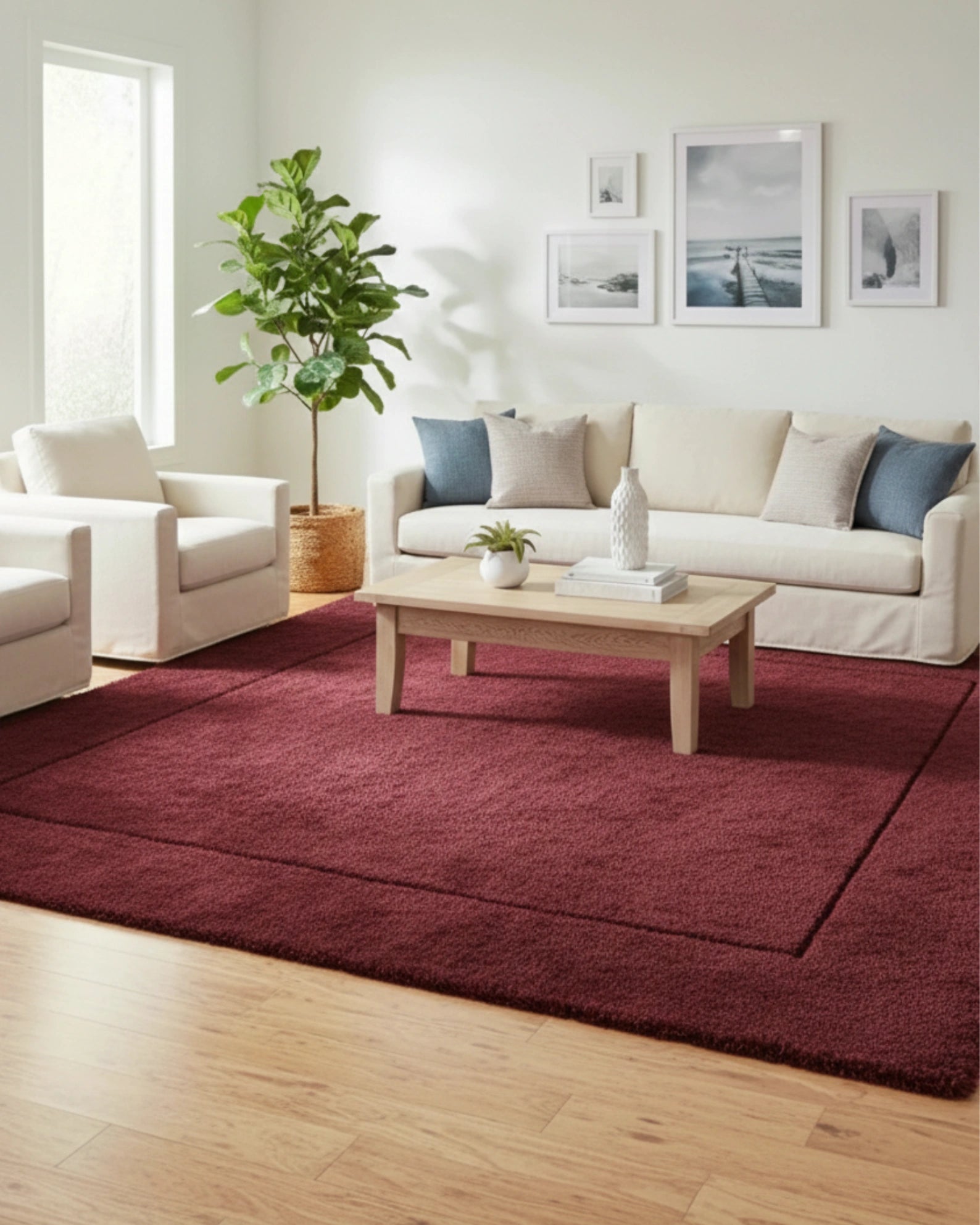 Maroon solid area rug with a minimalist border, hand-tufted texture designed for modern interiors, adding a refined and elegant accent to the space