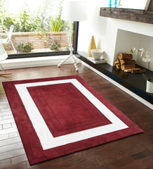 Modern red rug with bold white border and embossed detailing