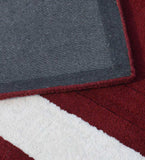Handcrafted red and white rug with embossed rectangular pattern