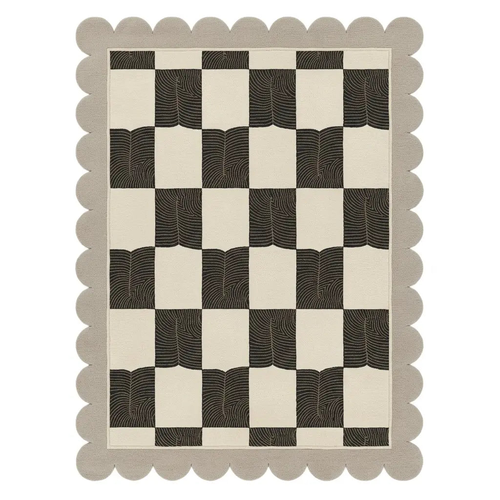 Checkered pattern rug with scalloped edge on a white background