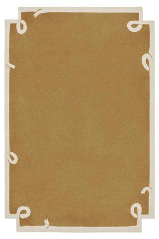 Minimalist camel brown hand-tufted wool rug with ivory border accents.