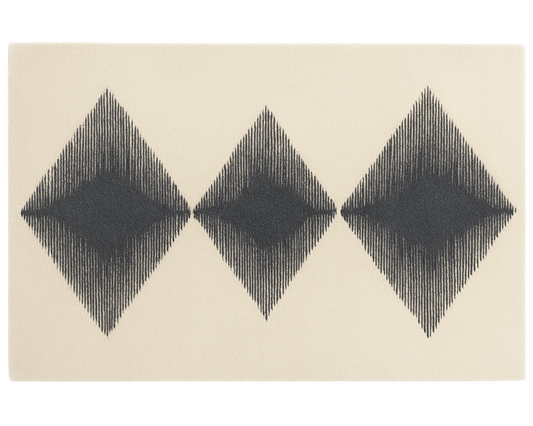 Hand-tufted wool rug with modern black and cream diamond pattern.