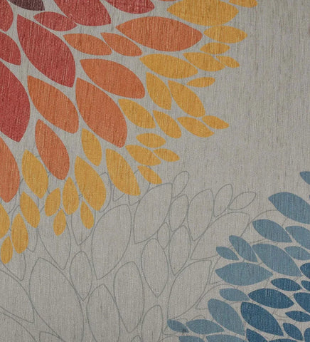 Low-profile neutral rug with teal and mustard floral accents.