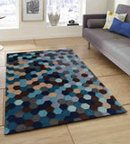 Modern living room with geometric hexagon pattern rug in blue, brown, and gray tones on wooden floor