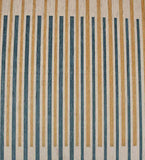 Modern luxury rug with alternating vertical beige and dark teal stripes, handwoven artistry pattern
