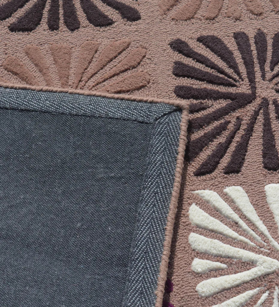 Contemporary hand-tufted rug with colorful floral block pattern