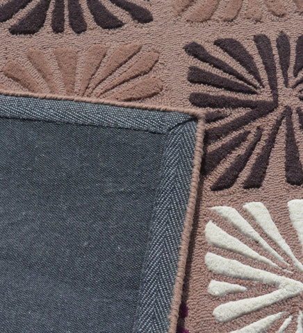 Contemporary hand-tufted rug with colorful floral block pattern