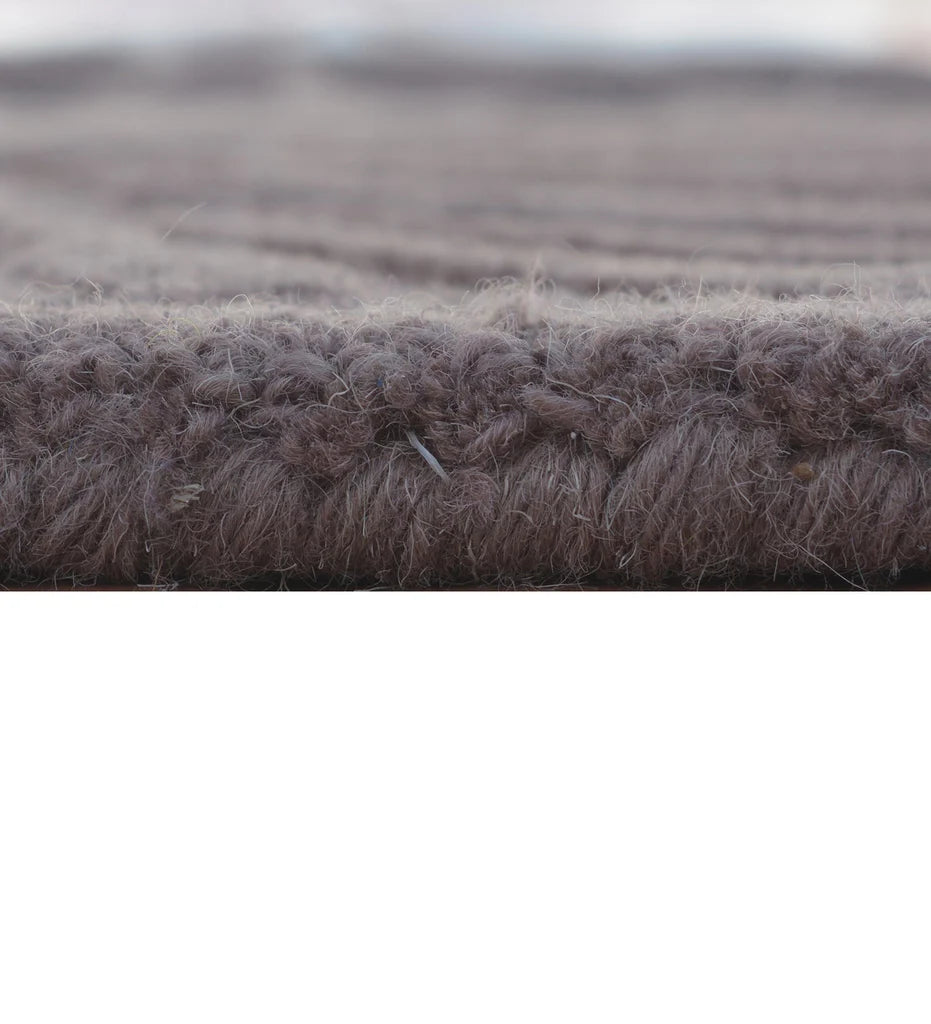 Eclectic wool rug in purple, white, and brown embossed design