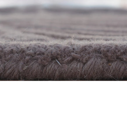 Eclectic wool rug in purple, white, and brown embossed design