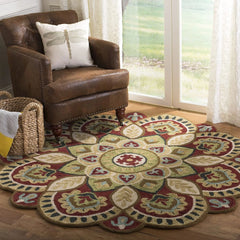 Bohemian round wool rug with red and green mandala design.
