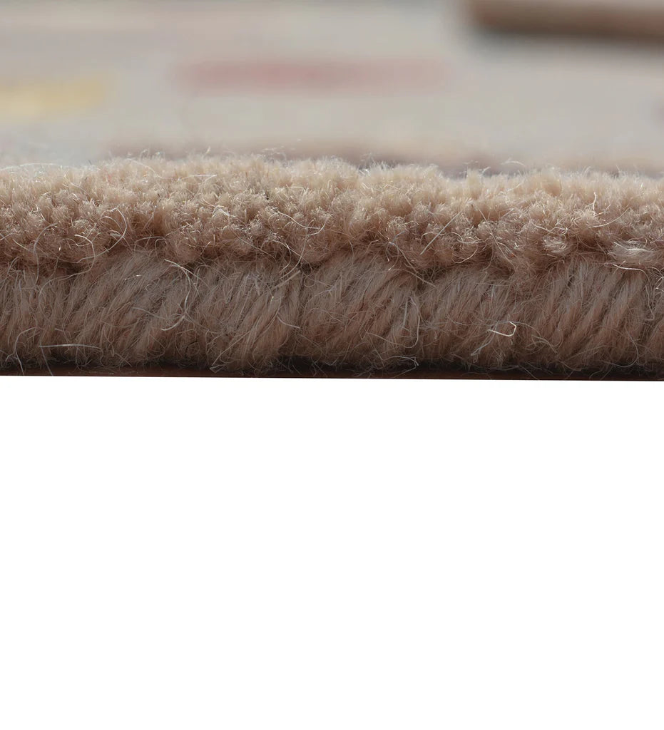 Eclectic wool rug in beige with modern patch-style motifs