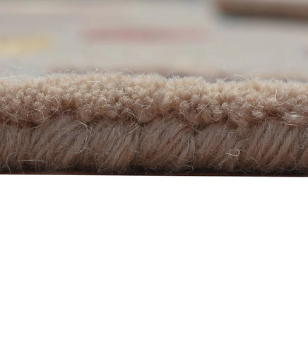 Eclectic wool rug in beige with modern patch-style motifs