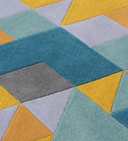 Geometric patterned rug with blue, yellow, and gray colors.