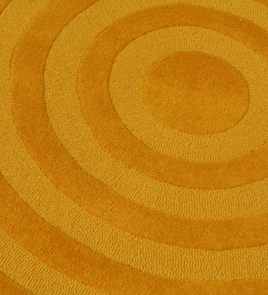 Luxury yellow hand-tufted rug with textured circle pattern