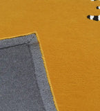 Contemporary geometric wool rug with mustard top and striped design.