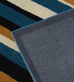 Contemporary wool rug with mustard and teal stripes for living room décor.