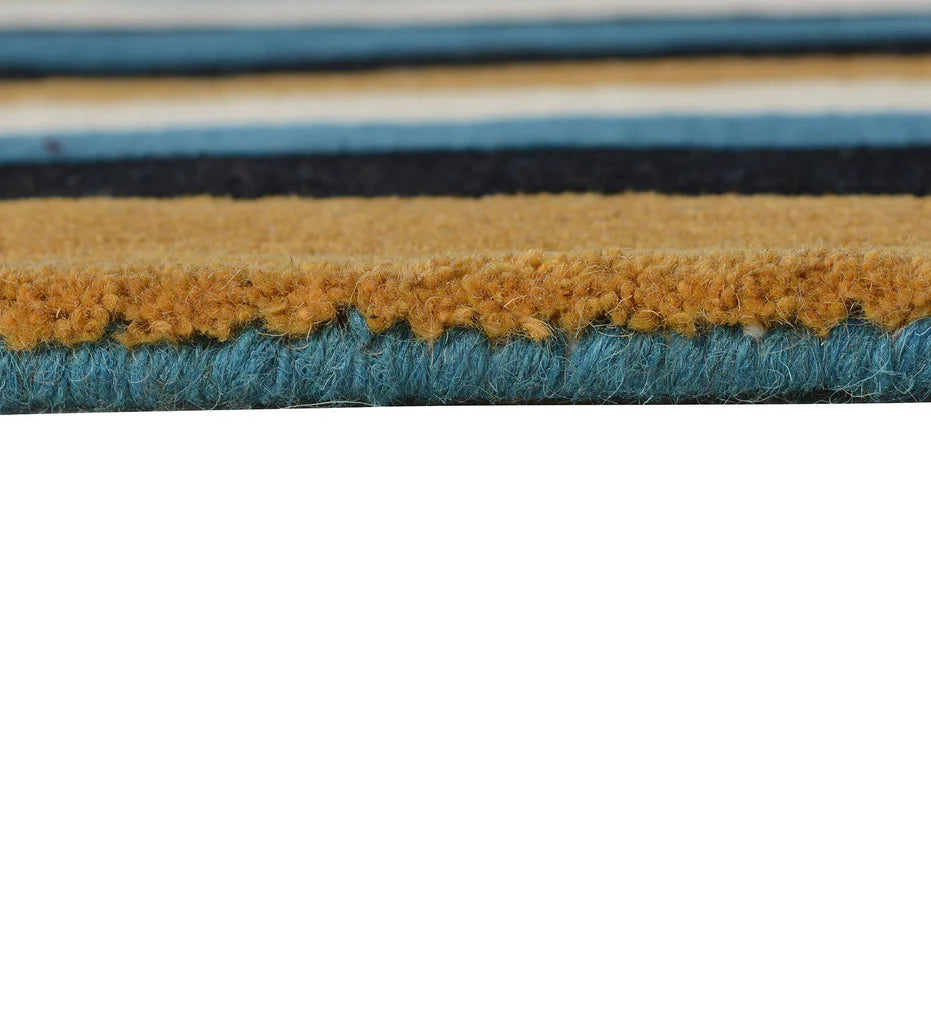 Handcrafted wool rug with modern striped pattern in mustard and blue.