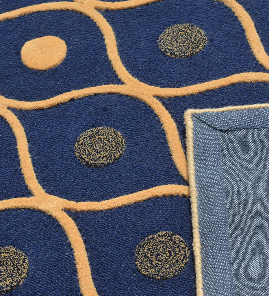 Contemporary hand-tufted rug in navy blue with beige accents