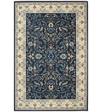 Navy blue traditional rug with intricate floral and vine patterns and beige decorative border