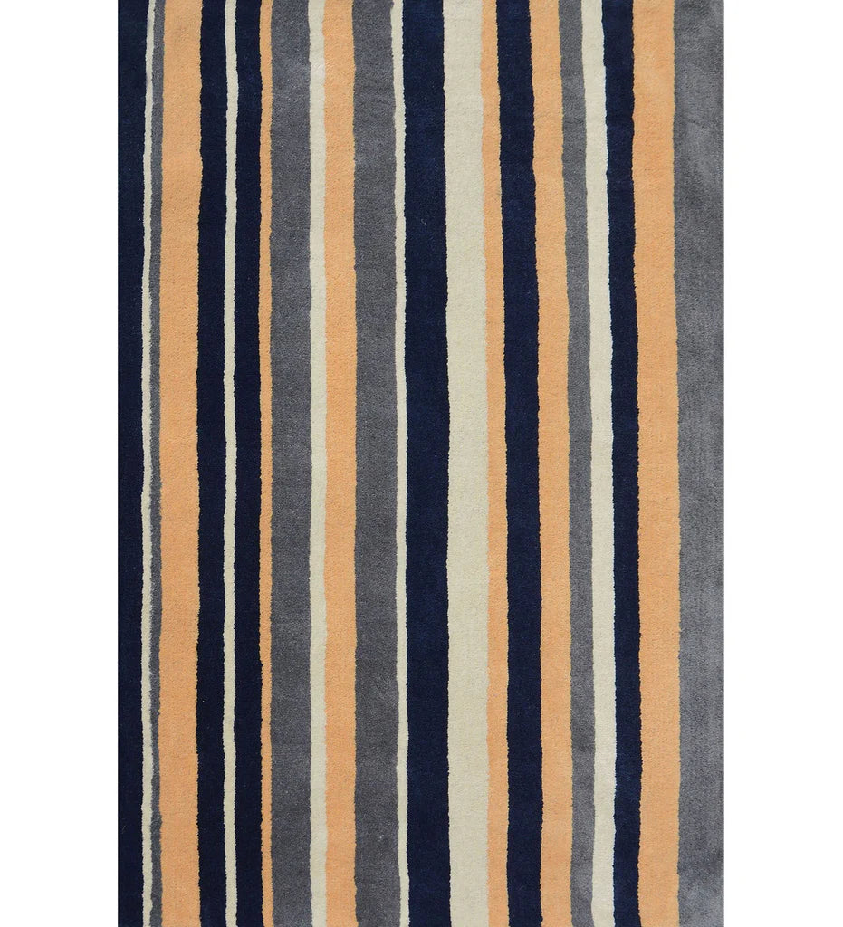 Navy blue, beige, and gray hand-tufted wool rug with vertical stripes.