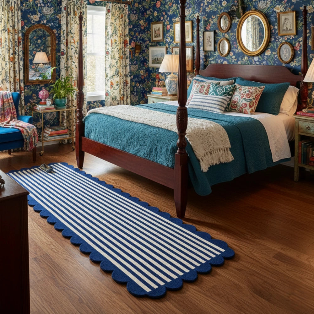 Navy blue and ivory scalloped border hand tufted runner rug placed in a bedroom for soft and cozy flooring