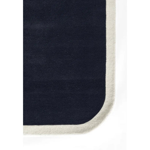 Blue and cream hand tufted rug
