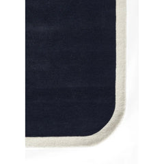 Blue and cream hand tufted rug