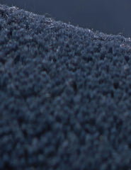 Cream and navy blue hand tufted rug